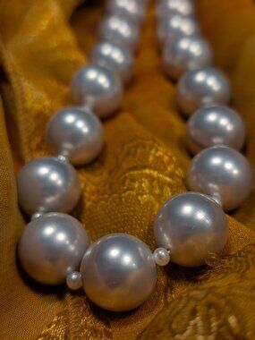 A beautiful silver grey pearl necklace.